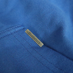 Load image into Gallery viewer, Deadstock clo metal tag on cobalt blue hoodie
