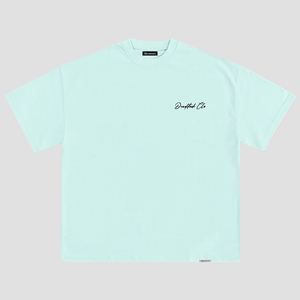The front of a blue shirt with deadstock clo printed on the left chest
